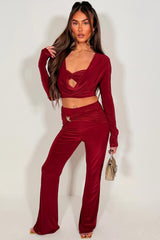 womens flare trouser and long sleeve crop top with cut out front two piece outfit set 