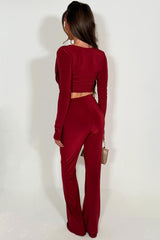 long sleeve cut out top and skinny flare trouser two piece co ord set burgundy night out occasion outfit styledup 