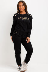frill shoulder gold button top and trousers two piece tracksuit set airport outfit