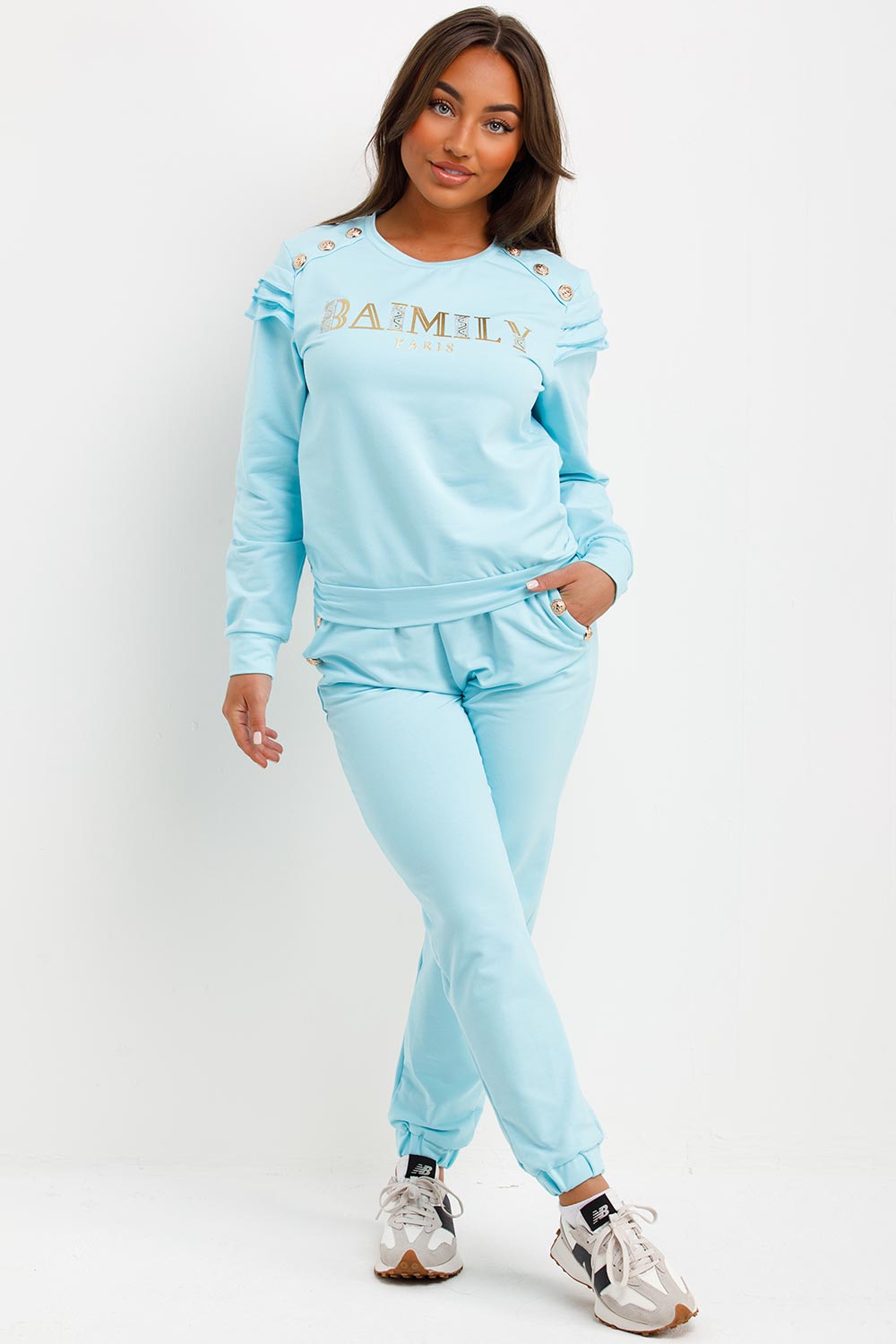 frill shoulder gold button top and trousers two piece tracksuit set airport outfit