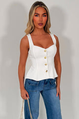 going out peplum top with gold buttons styledup 