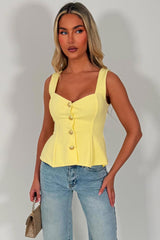 going out peplum top with gold buttons styledup 