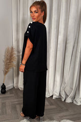 womens oversized top with gold button detail and matching wide leg trousers co ord set christmas party outfit