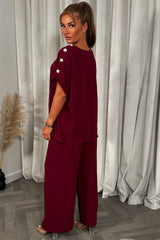 womens oversized top with gold button detail and matching wide leg trousers co ord set christmas party outfit