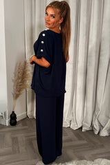 womens oversized top with gold button detail and matching wide leg trousers co ord set christmas party outfit