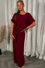 womens christmas party outfit top with gold button shoulder and matching trousers two piece co ord set 