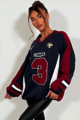 womens oversized sweatshirt athletic baseball jumper styled up 