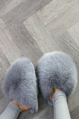 grey faux fur fluffy slippers styled up 