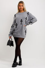 womens knitted jumper dress with long sleeves and crosses detail