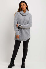womens knitted jumper with gold buttons and roll neck