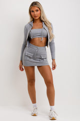 cargo mini festival skirt crop hoodie and bandeau top three piece outfit