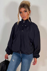 navy funnel neck jacket with cinched waist womens transitional autumn winter windbreaker jacket uk styledup
