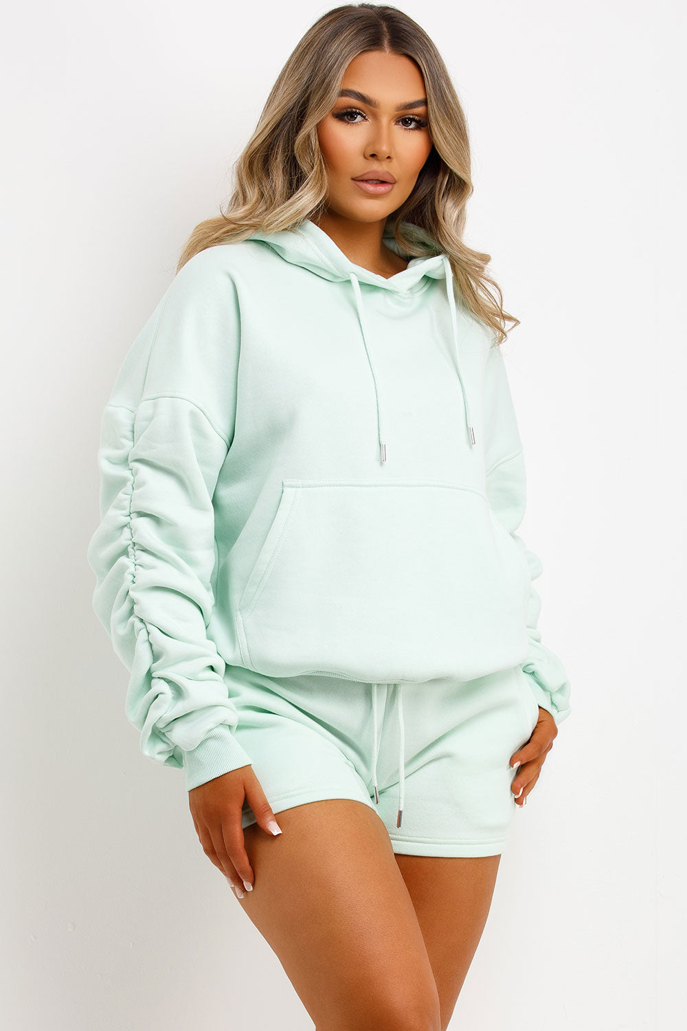 womens oversized ruched sleeve hoodie and shorts lounge set airport outfit