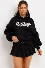 womens vintage hoodie sweatshirt with ruched sleeves styled up