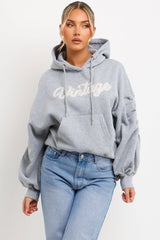 womens hooded sweatshirt with ruched sleeves and vintage embroidery