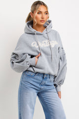 womens vintage hoodie sweatshirt with ruched sleeves styled up