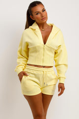 crop hoodie with cinched waist and shorts tracksuit two piece co ord set airport outfit