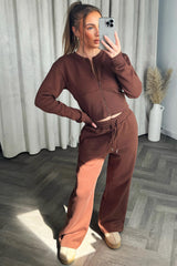 zip up crop sweatshirt corset detail and joggers tracksuit co ord set styledup airport travelling outfit 