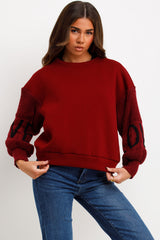 knitted sleeve love slogan jumper burgundy