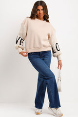 womens jumper with love slogan and knitted sleeves styledup