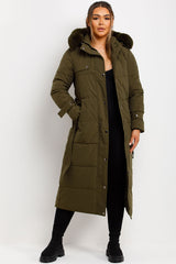 womens long puffer padded coat with faux fur hood and belt