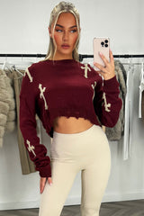 crop jumper with crosses and frayed hem burgundy