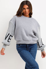 womens jumper with knitted sleeves love slogan styledup