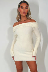 knitted jumper dress with long sleeves and off shoulder neckline styledup christmas party outfit 
