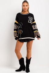 knitted jumper with teddy bear detail and contrast leopard print sleeves