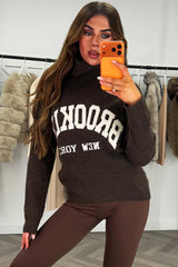 womens knitted roll neck jumper with brooklyn slogan brown 