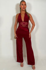 plunge halter neck backless wide leg jumpsuit with lace insert styledup 