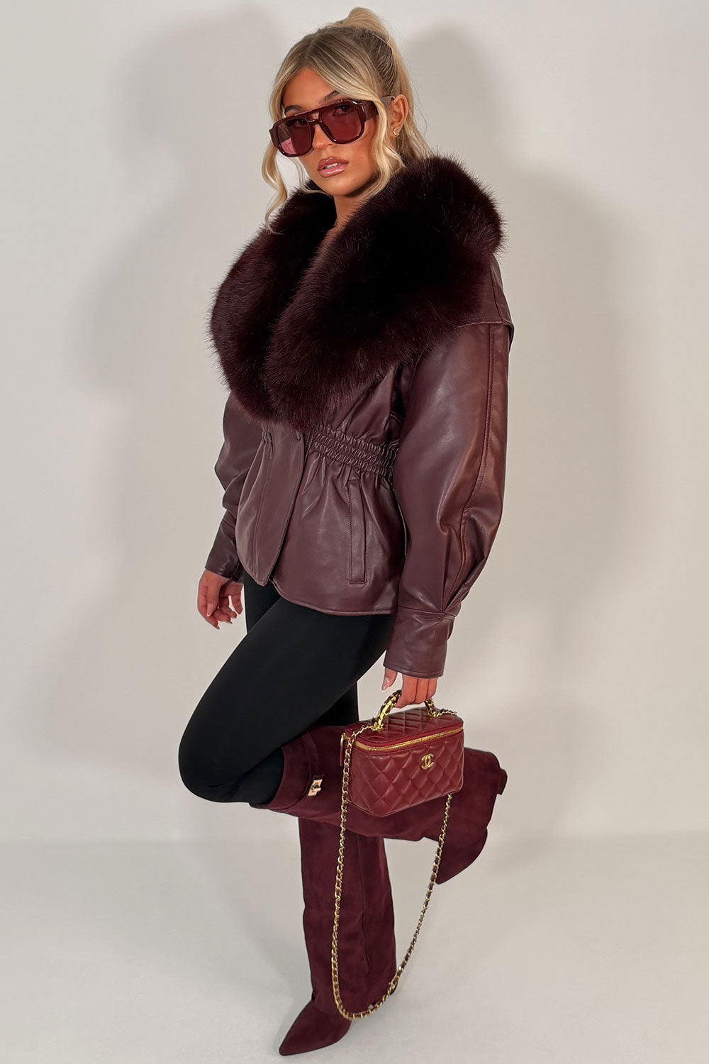 womens winter jacket with faux fur collar in faux leather cinched waistline styledup uk