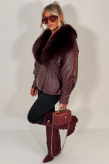 womens winter jacket with faux fur collar in faux leather cinched waistline styledup uk