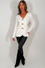long sleeve knitted jumper with gold buttons styled up 