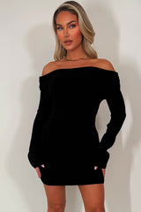 knitted jumper dress with long sleeves and off shoulder neckline styledup christmas party outfit 