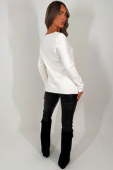 knitted jumper with gold buttons on the front for womens