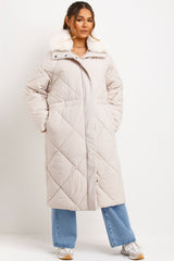 womens long winter coat with faux fur collar and drawstring waist styledup