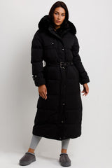 womens long puffer padded coat with faux fur hood and belt