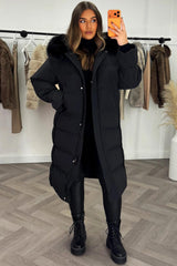 womens long padded puffer down coat with faux fur hood in black colour 