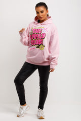 womens pink oversized winter hoodie with the lovely club graphic slogan
