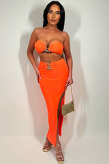 neon orange maxi skirt with side cut and bandeau top with gold buckle two piece co ord set