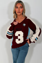 womens oversized sweatshirt athletic baseball jumper styled up 