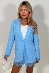 womens blue blazer with lace hem and lace cuffs