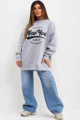 grey oversized sweatshirt with new york slogan