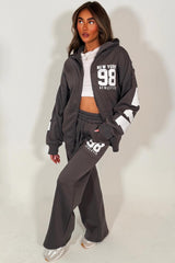 womens zip up hooded sweatshirt and wide leg jogger loungewear tracksuit with new york athletic slogan written on back styledup