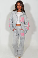 womens zip up hooded sweatshirt and wide leg jogger loungewear tracksuit with new york athletic slogan written on back styledup