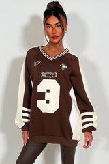 womens oversized sweatshirt athletic baseball jumper styled up 