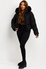 womens black padded puffer jacket with faux fur hood and thumb holes