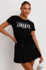 womens black t shirt with button shoulders and liberte paris embroidery casual outfit