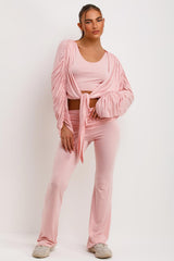 pink fold detail flared trousers crop top and ruched sleeve cardigan three piece matching lounge set